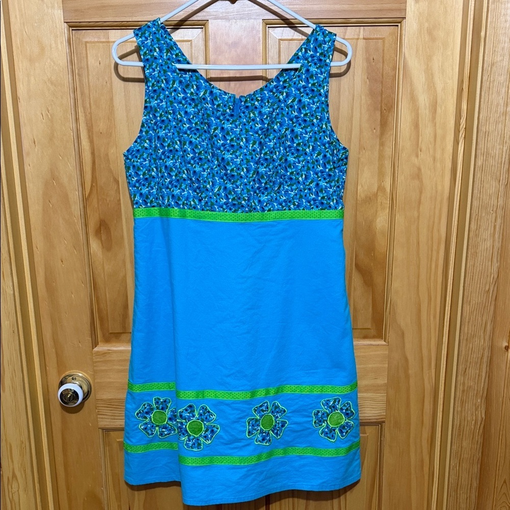 Sleeveless Blue Floral A-Line Dress with Green Ribbon Trim & Floral Appliqués.